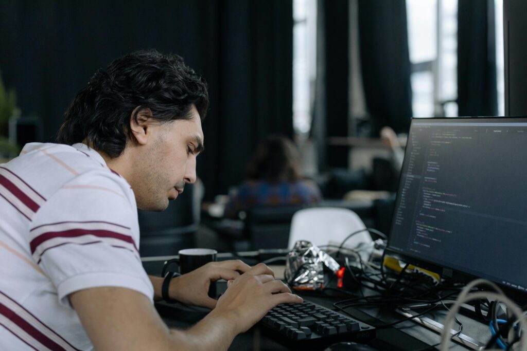 a man sitting at a computer